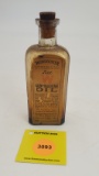 Winchester Gun and Machine Oil glass bottle with paper label, empty