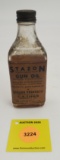 Stanzon Gun oil, glass bottle paper label partial