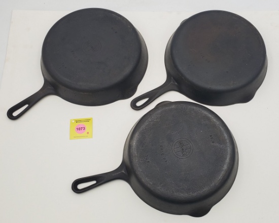 Skillets: Lot of 3: Griswold, marked No. 8, Erie PA, marked 704 I (2). Marked 704 T (1).
