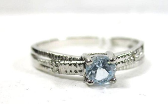 Crisscross Sky Blue Topaz Ring with Diamond in sterling silver