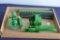 (3) ERTL JOHN DEERE TOYS TO INCLUDE , SQUARE BALER, GRAIN PLATFORM AND JD TRACTOR ON STEEL