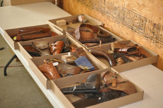 LARGE COLLECTION OF HOLSTERS, STOCKS, AND OTHER GUN PARTS