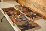 LARGE COLLECTION OF HOLSTERS, STOCKS, AND OTHER GUN PARTS