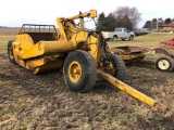 Caterpillar pull-type dirt scraper