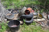 Scrap iron piles on North and South side of shop