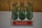 Coca Cola glass bottles w/Coca Cola metal carrier