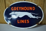 Greyhound Lines hanging porcelain sign