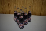 (6) Pepsi Cola 12oz glass bottles and cardboard 12oz carrier