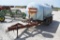 1,025 gal. poly tank on tandem axle trailer