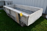 large grout tub with wooden extensions