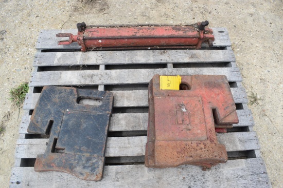 Pallet w/ 5 suitcase weights and hyd. cylinder