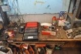 Contents on and under work bench, work bench stays with property