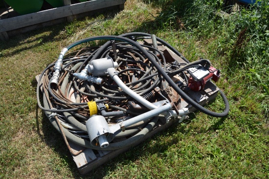 Pallet of hose , cable and a product pump