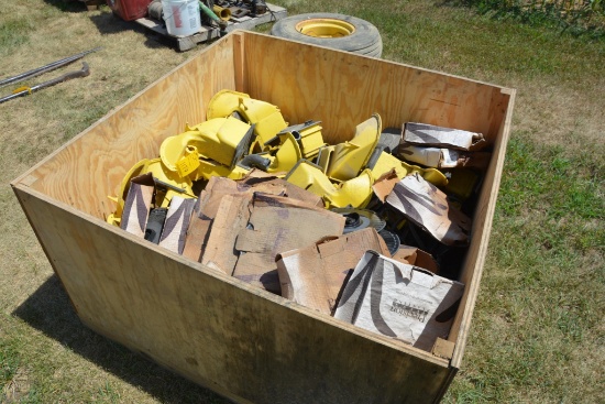 Pallet of John Deere planter parts and precision seed disks