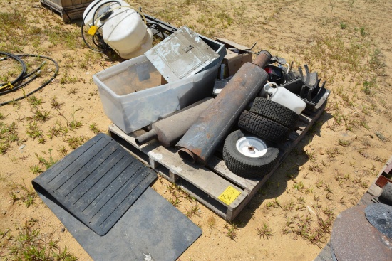 Pallet of items including; tractor mufflers, wheels, foam marking soap, etc.