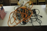 assortment of extension cords and light bulbs