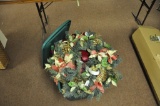 Christmas wreath and Christmas ornaments in a tote