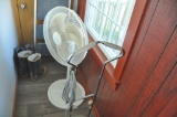 Fan on stand and older floor cleaner