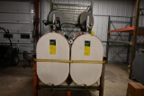 Dual 275 gal. tanks, auto guns, hose reels contains 15W-40, JD Hy-Gard, sells w/framing