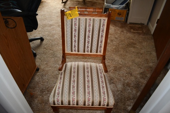 Wooden chair on rollers