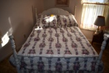 wooden full bed with hanging picture