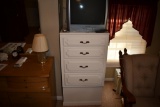 4 drawer stand up wooden dresser with Magnavox TV.