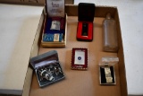 flat of Lighters, and cuff links