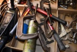 flat of hand tools including hammer, bolt cutter, and clamps