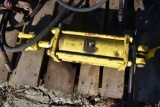 Yellow John Deere hydraulic cylinder