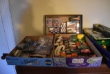 4 flats of 1:64 scale toys of cars, motorcycles, semi, and trailers