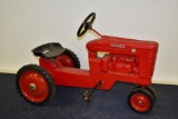 Scale Models Farmall M metal pedal tractor with narrow front end with plastic seat signed by Joseph