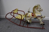 Child's metal rocking horse with wooden seat