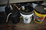 Assortment of 5-gallon buckets of farm fluids
