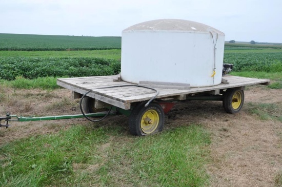 14' wooden hayrack on JD running gear w/tank & pump