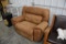 Tan colored reclining chair