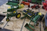 4 John Deere toys to include, tractors, baler, and planter