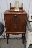 Vintage wooden radio on legs and clock