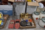 Flat of items to include, metal windmill, good year tire ash tray, bell, and 2 cars