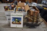 Cartoon VHS tapes, plastic cups, sail boat, John Deere book