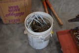 Bucket of hardware and concrete tools