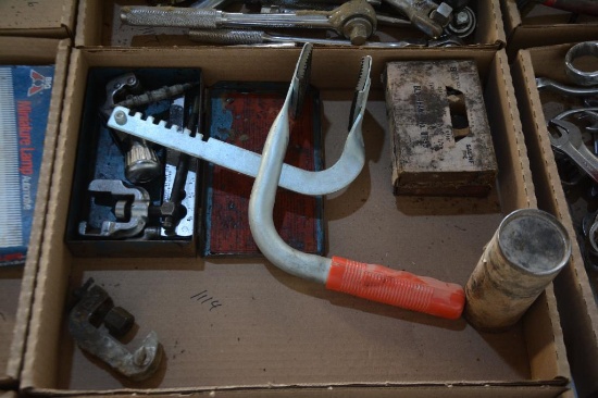 Pipe cutters and a compression tool