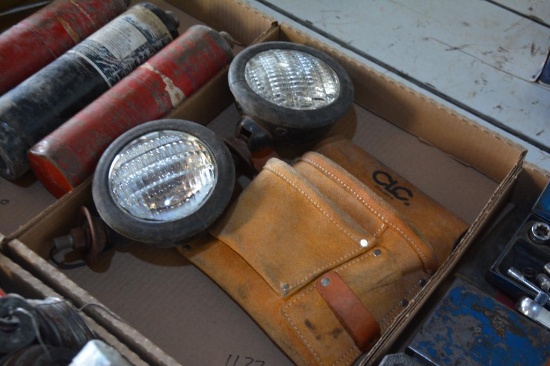 (2) smaller headlights and a tool pouch