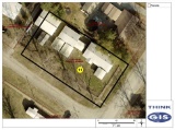 Lot 11: 208' x 104' lot improved with 1-story, 2-bedroom 2-bath brick home