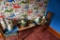 (4) Flats of flower planters, enamel measuring can, older elec. Iron, etc.