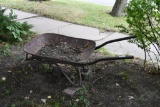 Rustic metal wheel barrow with steel wheel