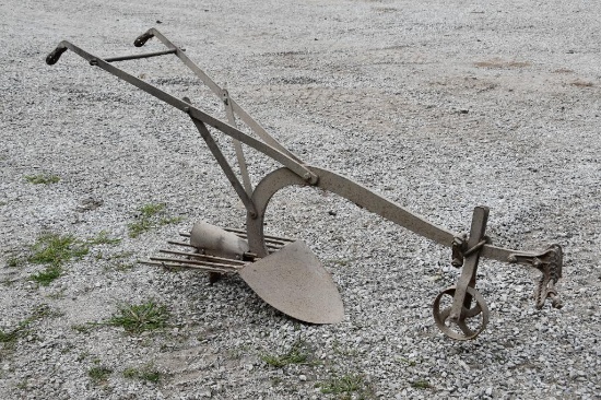 Walk behind potato plow