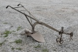 Walk behind potato plow