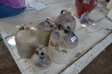 Quantity of pottery jugs in various forms of condition