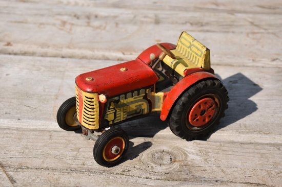 Early wind up tin tractor