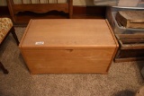Wooden trunk with linens and quilt
